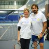 Michèle Laroque et Henri Leconte parrain et marraine de l'association 'Enfant Star et Match', participent à un tournoi de tennis organisé à Levallois-Perret le 10 février 2014