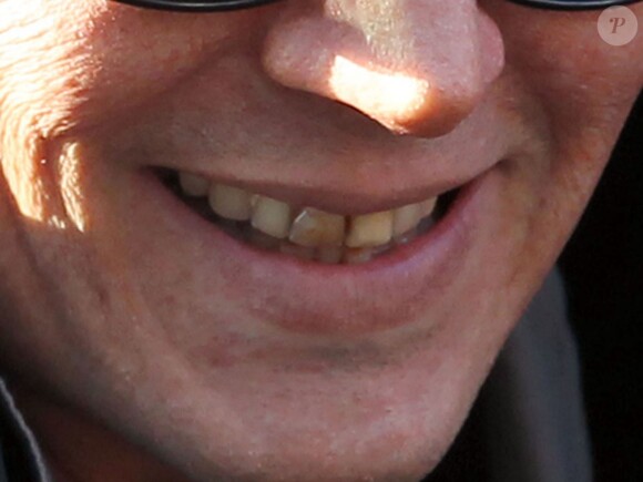 Johnny Depp (les dents jaunes) sur le tournage du film "Black Mass" à Boston, le 21 mai 2014.
 