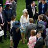 La princesse Beatrice d'York participait avec la reine Elizabeh II et le duc d'Edimbourg, le 21 mai 2014 dans le parc de Buckingham Palace, à la première garden party royale de l'année.