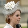 La princesse Beatrice d'York, coiffée d'un chapeau Robyn Coles, participait avec la reine Elizabeh II et le duc d'Edimbourg, le 21 mai 2014 dans le parc de Buckingham Palace, à la première garden party royale de l'année.