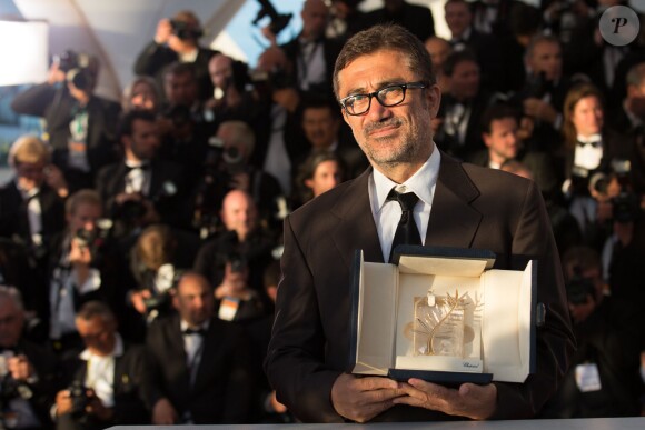 Nuri Bilge Ceylan, Palme d'Or pour "Winter Sleep" - Photocall de la remise des prix du 67e Festival du film de Cannes le 24 mai 2014.