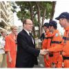 Charlene de Monaco était habillée en orange en hommage aux bénévoles du Grand Prix de Monaco lors de la visite qu'elle leur a rendue avec le prince Albert le 22 mai 2014