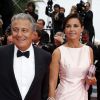 Christian Clavier et sa compagne Isabelle De Araujo (Bijoux APM Monaco) - Montée des marches du film "Jimmy's Hall" lors du 67e Festival du film de Cannes le 22 mai 2014