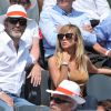 Enora Malagré, accompagnée de William Lowenstein, assiste aux Internationaux de France de tennis de Roland-Garros à Paris, le 31 mai 2014.