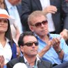 Patrick Poivre d'Arvor et son amie à Roland-Garros à Paris, le 2 juin 2014.
