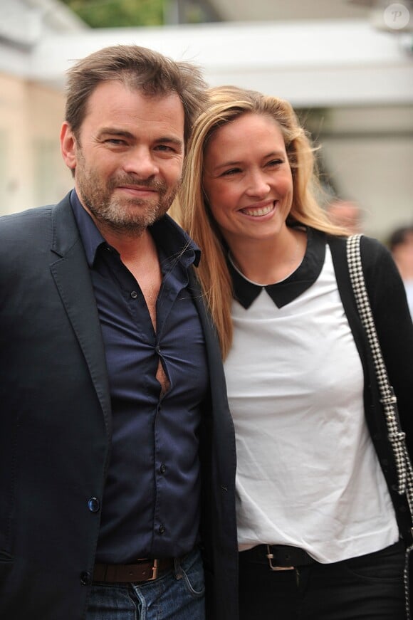Clovis Cornillac et sa femme Lilou Fogli au village Roland-Garros à Paris, le 3 juin 2014.