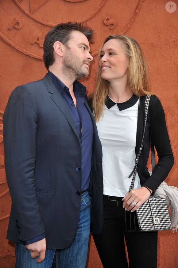 Clovis Cornillac et sa femme Lilou au village Roland-Garros à Paris, le 3 juin 2014.