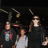 Please hide children's faces prior to the publication - Angelina Jolie and Brad Pitt make their way through LAX as they arrive with Maddox and Zahara for a departing flight out of Los Angeles. The family was accompanied by there security as fans and onlookers tried to snap pictures and say hello. Brad wore a beige blazer with matching pants and a fedora while his beautiful wife Angelina went with an all black ensemble. Los Angeles, CA, USA on June 6, 2014. Photo by GSI/ABACAPRESS.COM07/06/2014 - Los Angeles