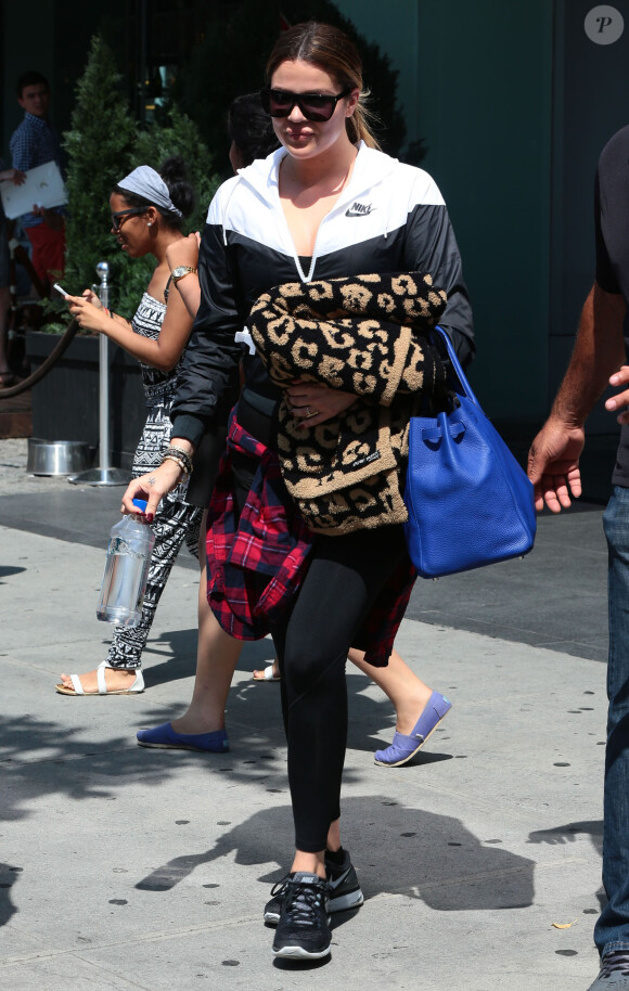 Kim Kardashian, sa fille North West, Khloe Kardashian et son petit ami French Montana à la sortie de leur hôtel à New York, le 28 juin 2014