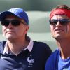 Laurent Ruquier et son compagnon Benoît assistent au match de la France contre l'Allemagne, à Rio de Janeiro, au Brésil, le 4 juillet 2014.