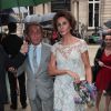 Valentino Garavani, en charmante compagnie, arrive à l'hôtel Salomon de Rothschild pour assister au défilé Valentino haute couture automne-hiver 2014-2015. Paris, le 9 juillet 2014.