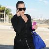 Khloé Kardashian prend un vol à l'aéroport de LAX à Los Angeles, le 13 juillet 2014.