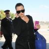 Khloe Kardashian prend un vol à l'aéroport de LAX à Los Angeles, le 13 juillet 2014.