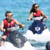 Lucas Digne et sa compagne Tiziri lors d'une randonnée à jet-ski dans le Golfe de Saint-Tropez, le 17 juillet 2014