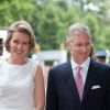 Le roi Philippe et la reine Mathilde de Belgique dans le parc royal de Bruxelles, à l'occasion de la fête nationale, le 21 juillet 2014.