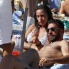 Raffaella Fico, l'ex de Mario Balotelli, et son fiancé Gianluca Tozzi au Club 55 de Saint-Tropez, le 30 juillet 2014