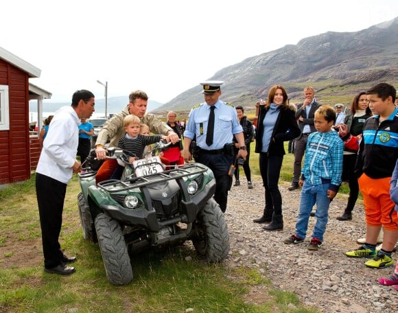 HRH Crown Prince Frederik, with Prince Vincent and Princess Josephine drives on a quad on their first day of the summer tour in Greenland. The Crown Prince of Denmark and his family visit Greenland from 1-8 August 2014 in connection with the summer cruise on the Royal Yacht. Photo by Albert Nieboer/RPE/DPA/ABACAPRESS.COM03/08/2014 - Igaliko