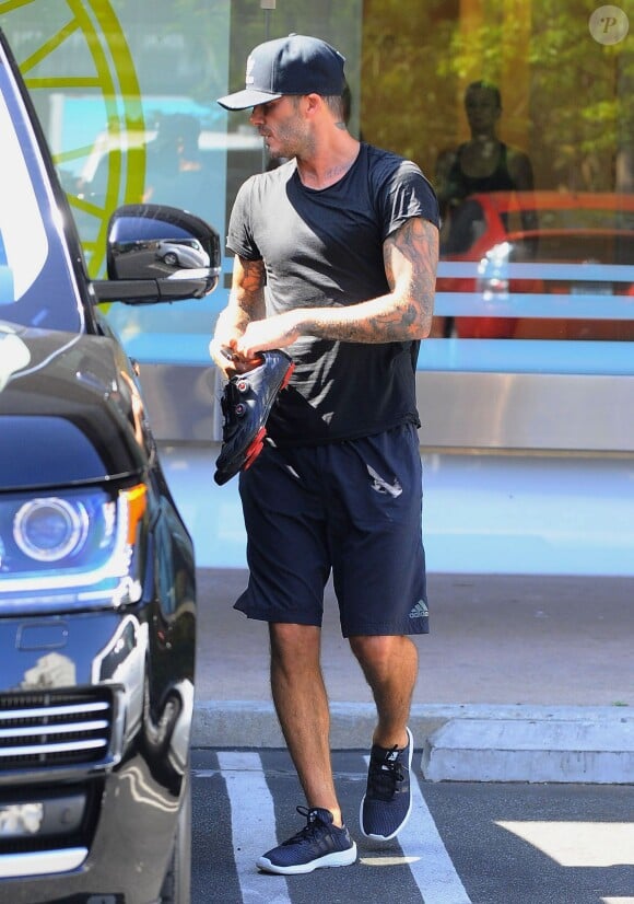 David Beckham remonte à bord de son 4*4 Range Rover à l'issue d'une séance de sport à la salle de gym Soul Cycle. Brentwood, Los Angeles, le 14 août 2014.