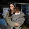 Kourtney Kardashian et Penelope Disick arrivent à l'aéroport de LAX à Los Angeles, le 16 août 2014. Ils rentrent de New York où elle a tourné des scènes de sa télé-réalité dans les Hamptons.