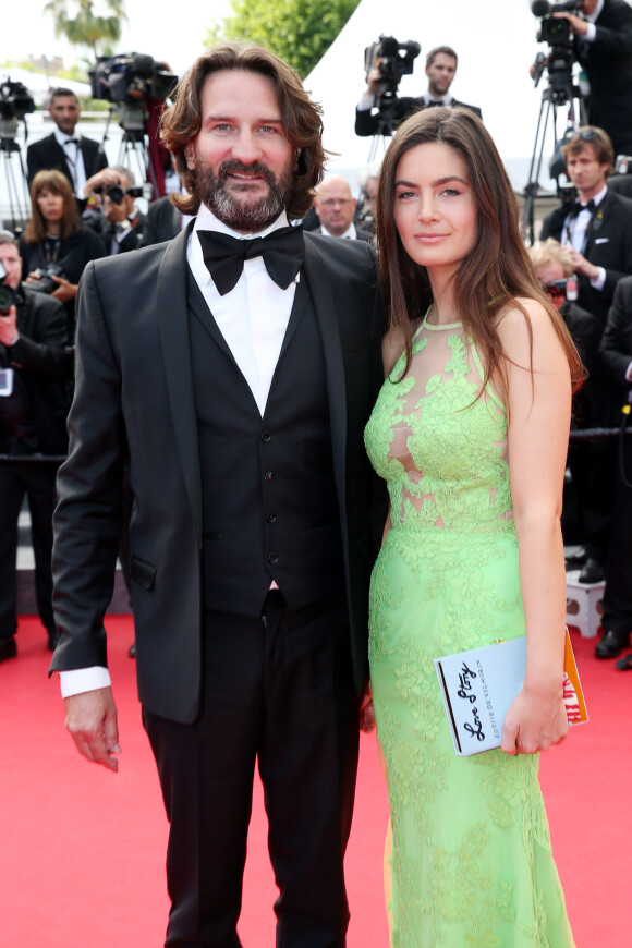 Frédéric Beigbeder et sa femme Lara Micheli lors de la montée des marches du film Saint Laurent et l'hommage au cinéma d'animation, durant le Festival de Cannes le 17 mai 2014