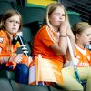 Les princesses Ariane, Catharina-Amalia et Alexia, filles du roi Willem-Alexander et de la reine Maxima des Pays-Bas, lors de la finale des championnats du monde de hockey entre les Pays-Bas et l'Australie à La Haye le 15 juin 2014.