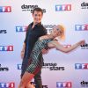 Brian Joubert et Katrina Patchett lors du photocall de présentation de la nouvelle saison de "Dance avec les Stars 5" au pied de la tour TF1 à Paris, le 10 septembre 2014