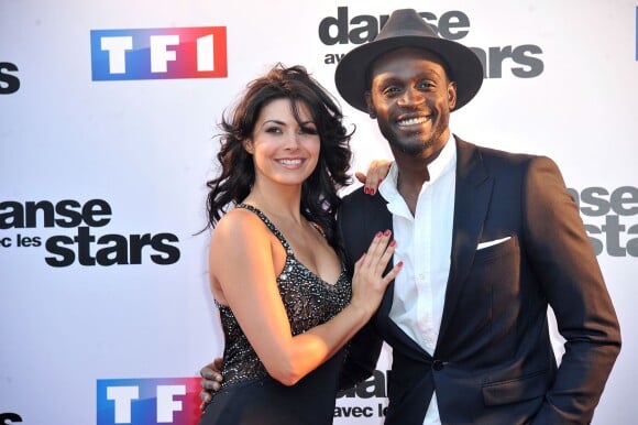 Corneille et Candice Pascal lors du photocall de présentation de la nouvelle saison de "Dance avec les Stars 5" au pied de la tour TF1 à Paris, le 10 septembre 2014