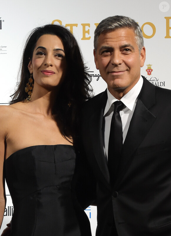 George Clooney et sa future femme Amal Alamuddin à la soirée "Celebrity Fight Night" à Forte dei Marmi (non loin de Florence) le 7 septembre 201