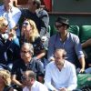 Julie Ferrier, Sofia Essaïdi et son compagnon Adrien Galo dans les tribunes de Roland-Garros lors de la demi-finale de la Coupe Davis le 12 septembre 2014. 
