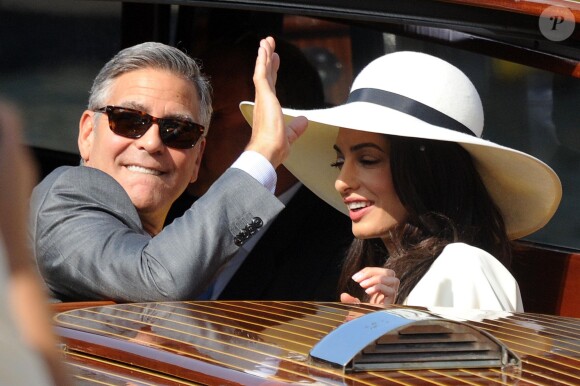 George Clooney et sa femme Amal Alamuddin quittant l'hôtel Cipriani pour se rendre au palais de Ca Farsetti à Venise, le 29 septembre 2014 pour leur mariage civil à la mairie de Venise qui va officialiser la cérémonie de samedi soir.