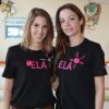 Léa François et Dounia Coesens, actrices de la série "Plus belle la vie" lors de la lecture de la dictée ELA à l'école du Val Fleuri à Chatou, le 13 octobre 2014.