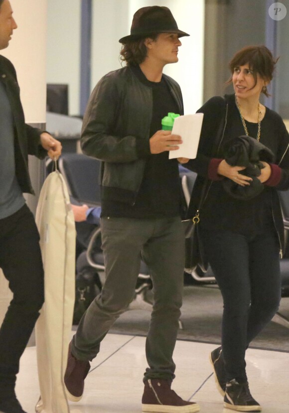 Exclusif - Orlando Bloom et Selena Gomez quittent l'aéroport de LAX à Los Angeles, le 20 octobre 2014.