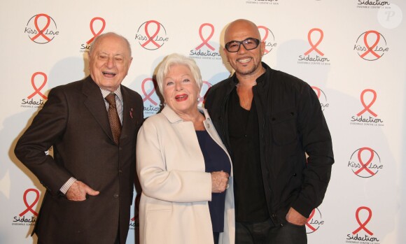 Line Renaud, Pierre Bergé et Pascal Obispo lors du photocall du lancement de l'album des 20 ans de Sidaction à l'Elysée Biarritz, à Paris le 22 octobre 2014.