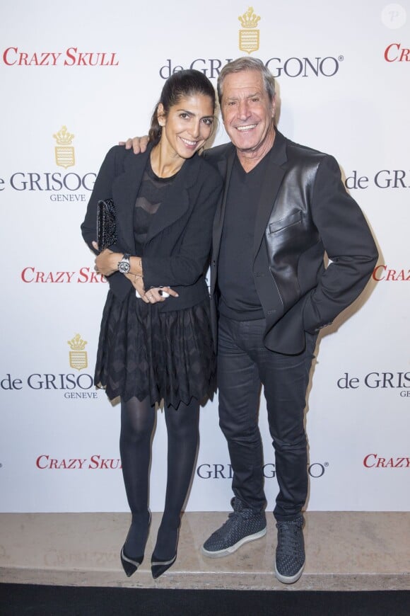 Jean-Claude Darmon et sa compagne Hoda Roche lors de la soirée De Grisogono à Paris le 23 octobre 2014. 