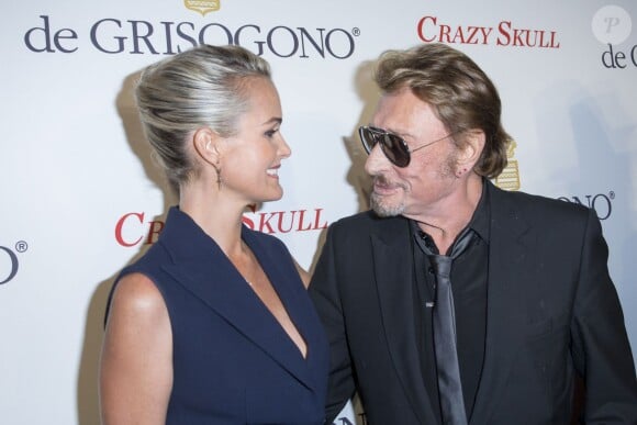 Johnny et Laetitia Hallyday plus in love que jamais lors de la soirée De Grisogono à Paris le 23 octobre 2014.