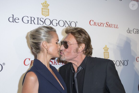 Johnny et Laetitia Hallyday plus in love que jamais lors de la soirée De Grisogono à Paris le 23 octobre 2014.