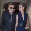 Johnny et Laetitia Hallyday arrivent à la soirée De Grisogono à Paris le 23 octobre 2014. 