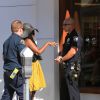 La photographe pris à parti par Suge Knight et son entourage reçoit des soins et l'aide de la police. Los Angeles, le 5 septembre 2014.