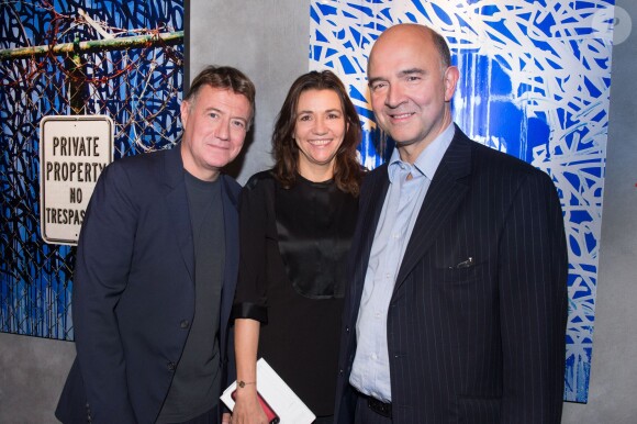 Exclusif - Jérôme Revon, Catherine Houard et Pierre Moscovici - Vernissage de l'Exposition "Murs-Murs" de Jerôme Revon à la galerie Catherine Houard à Paris le 13 novembre 2014.