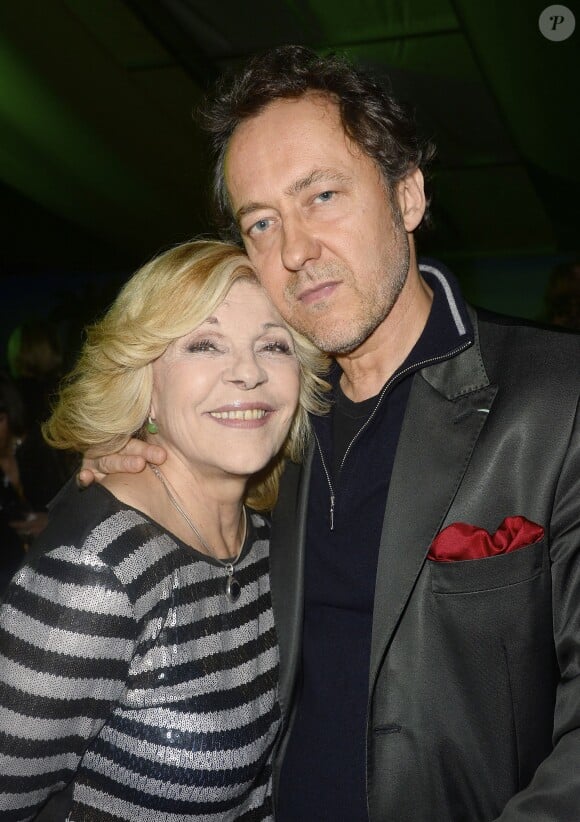 Nicoletta et son mari Jean-Christophe Molinier lors de la soirée "Brésil Team" au marché de Noël des Champs Elysées à Paris le 5 décembre 2014