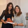 Marion Bartoli a reçu la visite de Malika Ménard au concept Store L'Escabeau de Marie France pour la présentation de sa collection "M by Musette" à Paris le 6 décembre 2014