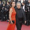 Christian Clavier et sa compagne Isabelle De Araujo lors de la première du film "The Immigrant" lors du 66e Festival du Film de Cannes, le 24 mai 2014.