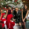 Le président Barack Obama, son épouse Michelle et leurs filles Malia et Sasha lors de l'enregistrement du concert Christmas in Washington à Washington, le 14 décembre 2014