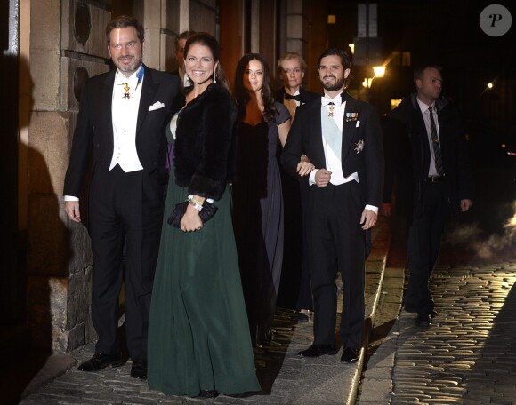 La princesse Madeleine de Suède, enceinte, et son mari Chris O'Neill arrivent à la Bourse de Stockholm pour assister à la soirée de l'Académie de Suède. Le 20 décembre 2014.