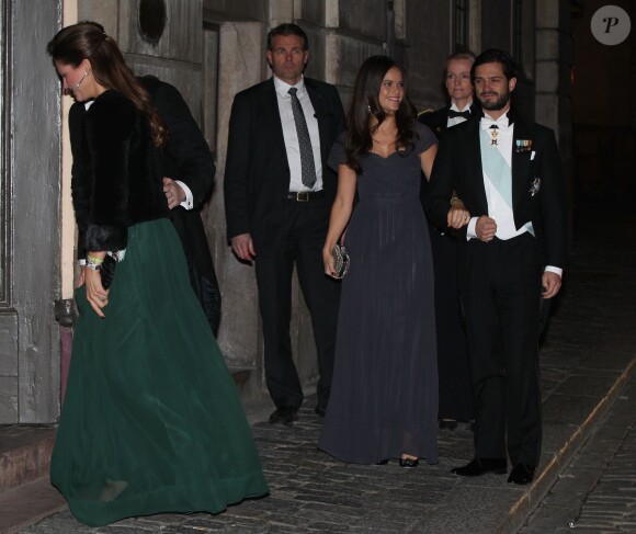 La princesse Madeleine de Suède, enceinte, et son mari Chris O'Neill ont assisté à la soirée de l'Académie de Suède à la Bourse de Stockholm. Le 20 décembre 2014.