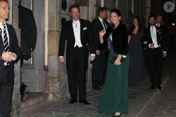 La princesse Madeleine de Suède, enceinte de son deuxième enfant, et son mari Chris O'Neill ont assisté à la soirée de l'Académie de Suède à la Bourse de Stockholm. Le 20 décembre 2014.