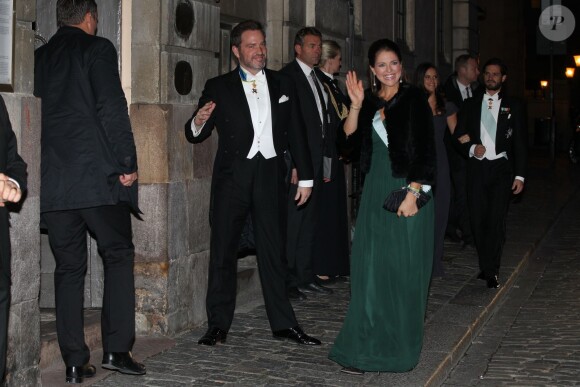 La princesse Madeleine de Suède, enceinte, et son mari Chris O'Neill ont assisté à la soirée de l'Académie de Suède à la Bourse de Stockholm. Le 20 décembre 2014.