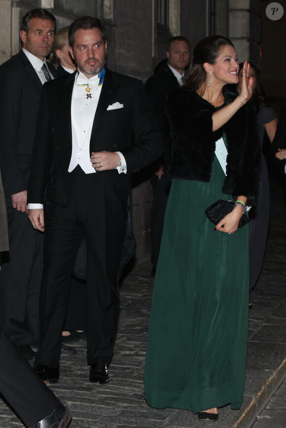 La princesse Madeleine de Suède et son mari Chris O'Neill, futurs parents d'un deuxième enfant, ont assisté à la soirée de l'Académie de Suède à la Bourse de Stockholm. Le 20 décembre 2014.