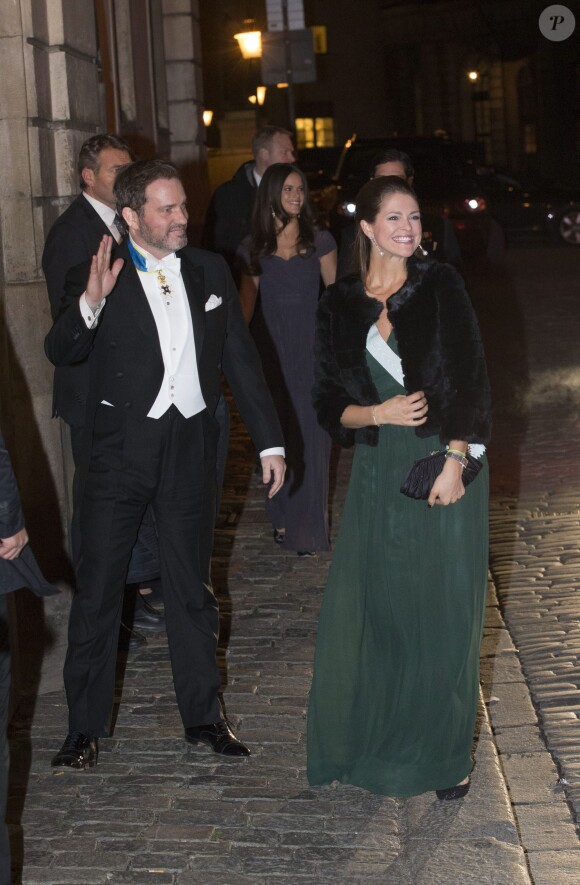 La princesse Madeleine de Suède, enceinte, et son mari Chris O'Neill ont assisté à la soirée de l'Académie de Suède à la Bourse de Stockholm. Le 20 décembre 2014.