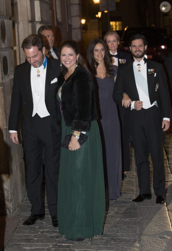 La princesse Madeleine de Suède, enceinte, et son mari Chris O'Neill ont assisté à la soirée de l'Académie de Suède à la Bourse de Stockholm. Le 20 décembre 2014.